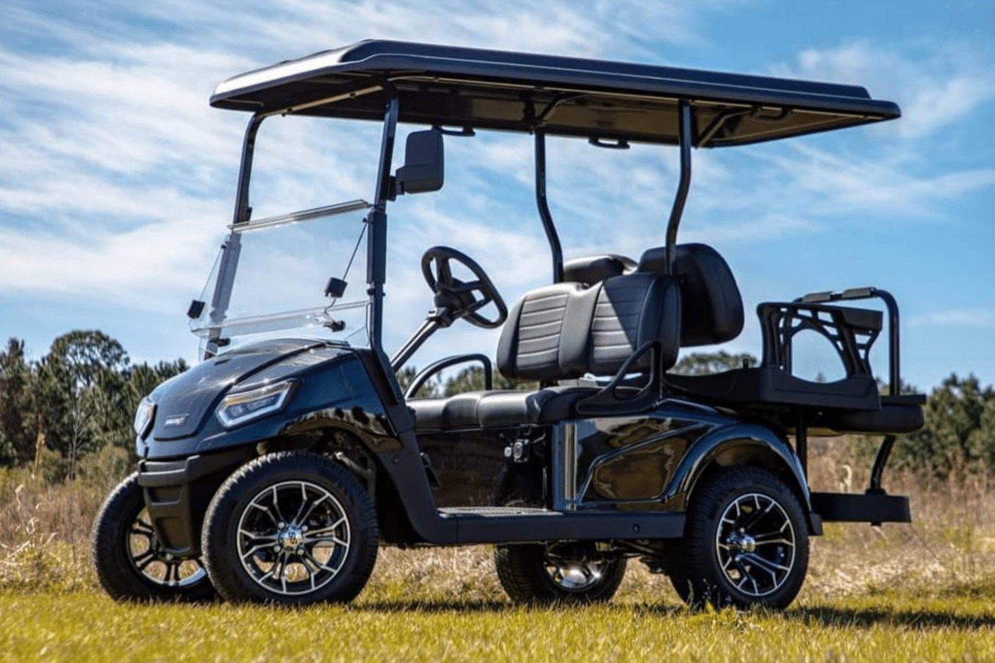 black golf cart available for financing in a field